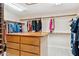 Large walk-in closet with ample shelving and drawers at 12210 N 76Th Pl, Scottsdale, AZ 85260