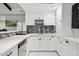 Wet bar with white cabinets, a sink, and wine storage at 12210 N 76Th Pl, Scottsdale, AZ 85260