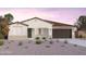 One-story home with dark brown garage door and desert landscaping at 1226 W J Waltz Way, Apache Junction, AZ 85120