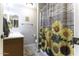 Clean bathroom with double vanity and sunflower shower curtain at 1229 E Prickly Pear St, Casa Grande, AZ 85122