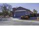 Front view of a one-story house with a gray exterior and landscaping at 1229 E Prickly Pear St, Casa Grande, AZ 85122