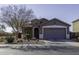 Gray house with attached garage and landscaping in front at 1229 E Prickly Pear St, Casa Grande, AZ 85122