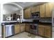 Modern kitchen with stainless steel appliances and granite countertops at 1229 E Prickly Pear St, Casa Grande, AZ 85122