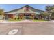 A picturesque clubhouse exterior with its inviting rustic facade and barn-style architecture at 12349 N 145Th Ave, Surprise, AZ 85379