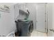 Modern laundry room with washer, dryer, and ample storage space at 12349 N 145Th Ave, Surprise, AZ 85379