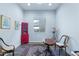 Bright living room featuring a red hutch and a window view to the backyard at 12349 N 145Th Ave, Surprise, AZ 85379