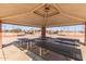 A shaded picnic area with tables and benches near baseball fields offering an outdoor community space at 12349 N 145Th Ave, Surprise, AZ 85379