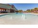 An inviting outdoor swimming pool with fountains in the background at 12349 N 145Th Ave, Surprise, AZ 85379