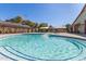 An inviting outdoor swimming pool with lounge chairs and shaded pergola perfect for community fun at 12349 N 145Th Ave, Surprise, AZ 85379