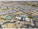 Aerial view of community with pool, tennis courts, and numerous homes at 1238 W Silver Creek Ln, San Tan Valley, AZ 85140