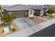 Aerial view of house, driveway and street at 1238 W Silver Creek Ln, San Tan Valley, AZ 85140