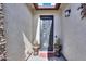 Elegant entryway with an ornate iron door and potted plants at 1238 W Silver Creek Ln, San Tan Valley, AZ 85140