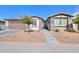 Single-story home with a two-car garage and desert landscaping at 1238 W Silver Creek Ln, San Tan Valley, AZ 85140