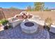 Firepit area with built-in seating and landscaping at 1238 W Silver Creek Ln, San Tan Valley, AZ 85140