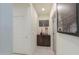 A charming hallway with decorative cabinet at 1238 W Silver Creek Ln, San Tan Valley, AZ 85140