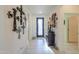 Spacious hallway with decorative crosses and a dark wooden console table at 1238 W Silver Creek Ln, San Tan Valley, AZ 85140