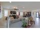 Open living area with sectional sofa, dining area and views into kitchen at 1238 W Silver Creek Ln, San Tan Valley, AZ 85140