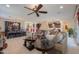 Bright and airy living room with a large sectional sofa and coffee table at 1238 W Silver Creek Ln, San Tan Valley, AZ 85140