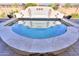 Round spa with blue water and stone coping at 1238 W Silver Creek Ln, San Tan Valley, AZ 85140