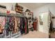 Bright walk-in closet offering custom closet organizers at 1238 W Silver Creek Ln, San Tan Valley, AZ 85140