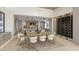 Open concept dining area with built-in wine storage and modern light fixture at 13192 E Cibola Rd # 26, Scottsdale, AZ 85259