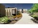 Contemporary home with desert landscaping and a paved driveway at 13192 E Cibola Rd # 26, Scottsdale, AZ 85259