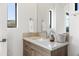 Modern bathroom vanity with light wood cabinets and quartz countertop at 13238 E Ranch Gate Rd, Scottsdale, AZ 85255