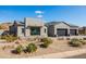 Modern home exterior with two-car garage and desert landscaping at 13238 E Ranch Gate Rd, Scottsdale, AZ 85255