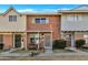 Brick front of charming townhome with a small landscaped area at 1387 N 44Th St, Phoenix, AZ 85008