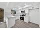 Renovated kitchen featuring white cabinets and a breakfast bar at 1387 N 44Th St, Phoenix, AZ 85008