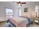 Serene bedroom with queen bed, nightstand, and window with garden view at 14228 N Yerba Buena Way, Fountain Hills, AZ 85268