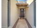 Light beige entryway with a dark brown door and stone flooring at 14228 N Yerba Buena Way, Fountain Hills, AZ 85268