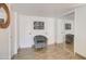 Entryway with patterned chair, mirror, and wood-look tile flooring at 14228 N Yerba Buena Way, Fountain Hills, AZ 85268