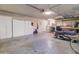 Garage with storage cabinets, washer, dryer, and home gym equipment at 14228 N Yerba Buena Way, Fountain Hills, AZ 85268