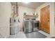 Bright laundry room with washer, dryer, and extra storage at 14228 N Yerba Buena Way, Fountain Hills, AZ 85268