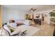 Bright living room with L-shaped sectional sofa and adjacent dining area at 14228 N Yerba Buena Way, Fountain Hills, AZ 85268