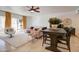 Living room with gray sectional sofa and wood dining table at 14228 N Yerba Buena Way, Fountain Hills, AZ 85268