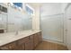 Bathroom features double sinks, light wood cabinets, and a shower at 14422 W Via Tercero --, Sun City West, AZ 85375