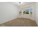 Bedroom with neutral carpeting and a large window offering natural light at 14422 W Via Tercero --, Sun City West, AZ 85375