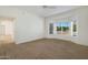 Well-lit bedroom with neutral carpeting and a bay window at 14422 W Via Tercero --, Sun City West, AZ 85375