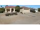 Single-story home with a two-car garage and desert landscaping at 14422 W Via Tercero --, Sun City West, AZ 85375