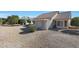 Rear view of house showing patio and landscaping at 14422 W Via Tercero --, Sun City West, AZ 85375