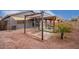 Backyard view showcasing a pergola and patio area at 14805 W Caribbean Ln, Surprise, AZ 85379