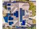 Aerial view of a house with solar panels on the roof at 14905 W Dovestar Dr, Surprise, AZ 85374