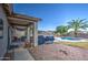 Relaxing backyard oasis with a sparkling pool, patio, and built-in grill at 14905 W Dovestar Dr, Surprise, AZ 85374