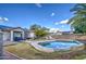 Inviting backyard oasis with a kidney-shaped pool and patio at 14905 W Dovestar Dr, Surprise, AZ 85374