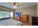 Main bedroom with large window and built-in dresser at 14905 W Dovestar Dr, Surprise, AZ 85374