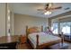 Spacious bedroom with wood flooring and ceiling fan at 14905 W Dovestar Dr, Surprise, AZ 85374