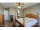 Bedroom with wood flooring and large window at 14905 W Dovestar Dr, Surprise, AZ 85374