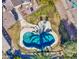 An aerial view of a kidney-shaped swimming pool in a backyard at 14905 W Dovestar Dr, Surprise, AZ 85374